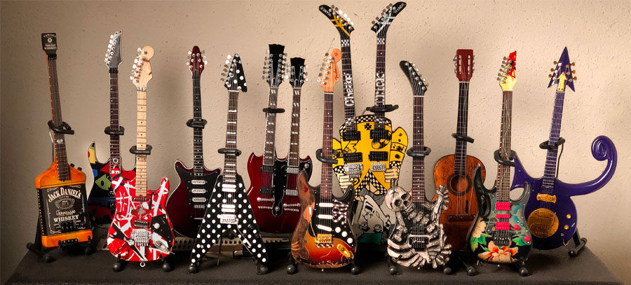 photo of a collection of miniature guitar replicas